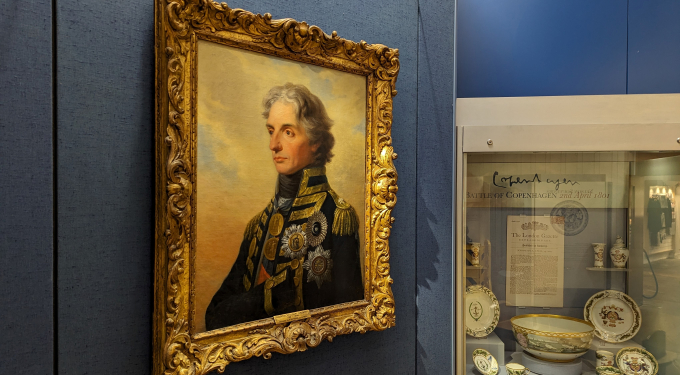 A gallery space featuring a 3/4 angle painting of Vice Admiral Lord Horatio Nelson