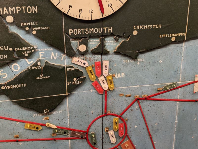 A wooden map showing the ship maneuvers of the Royal Navy during D-Day 