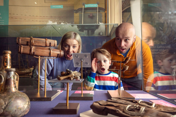 Family look at the unique artefacts salvaged from the HMS Invincible 1744 salvage site. 