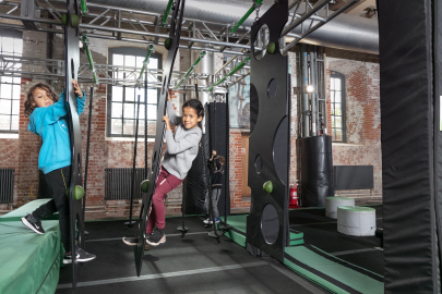Children climbing on an assault course