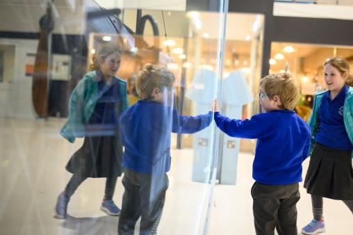 Two children interact with an exhibit at the Fleet Air Arm Museum