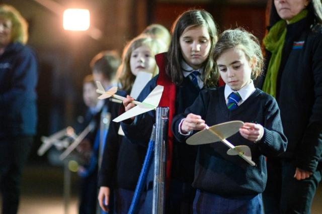 Primary age children experiment with wood and paper flying devices