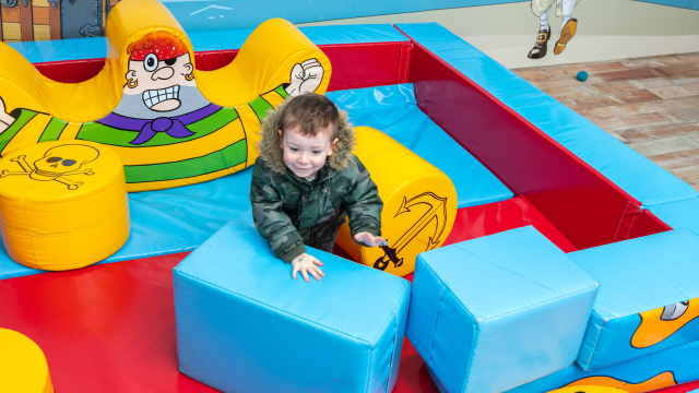 Child in soft play area