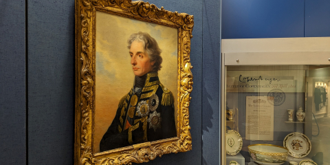 A gallery space featuring a 3/4 angle painting of Vice Admiral Lord Horatio Nelson