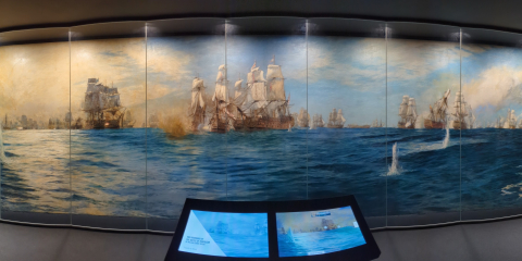 A panoramic photograph of a large naval battle painting